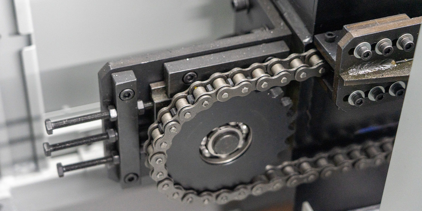 Heavy-duty dual-chain lifting mechanism for an industrial automatic pallet changer.
